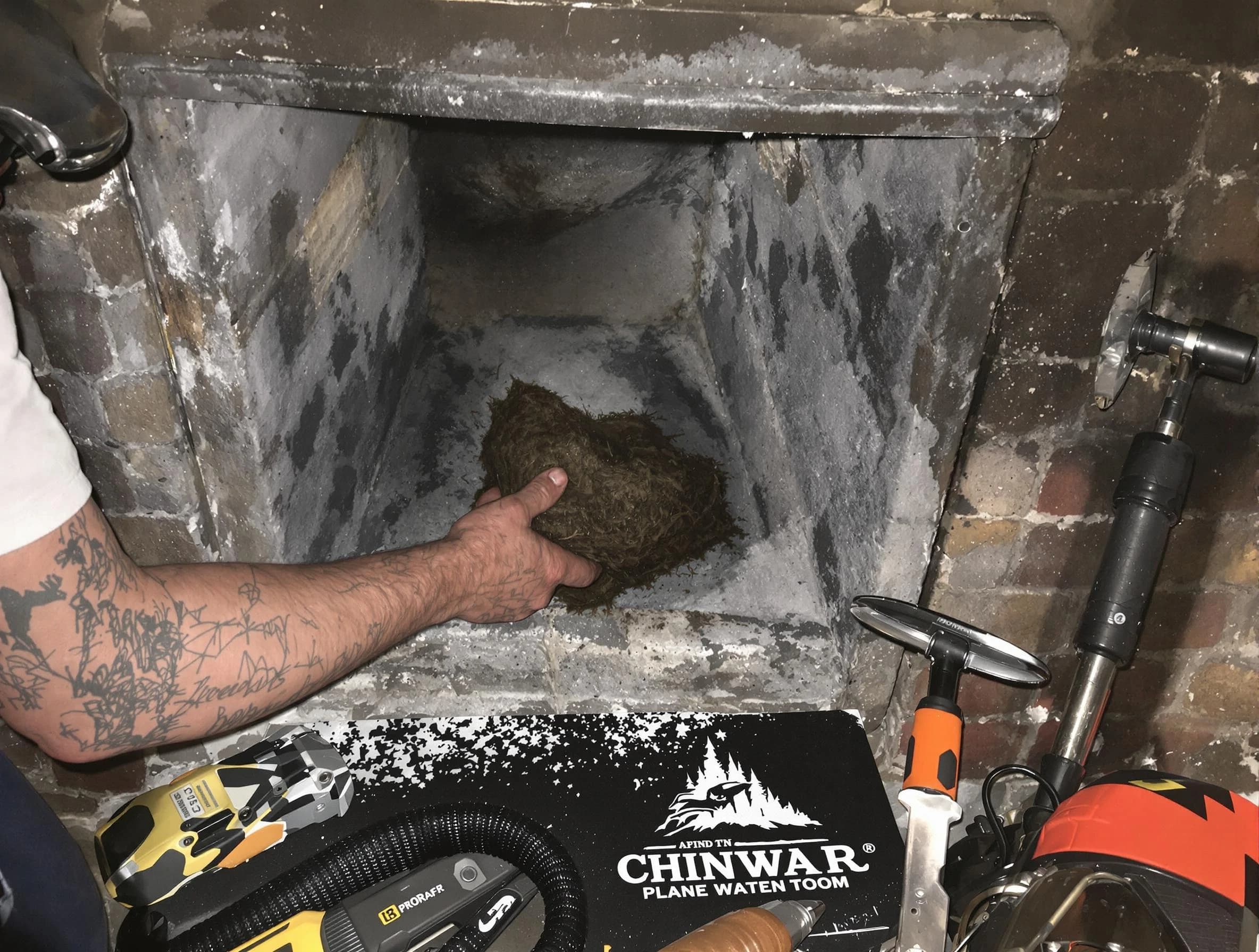 South Valley Chimney Sweep safely removing debris and screening chimney in South Valley, NM